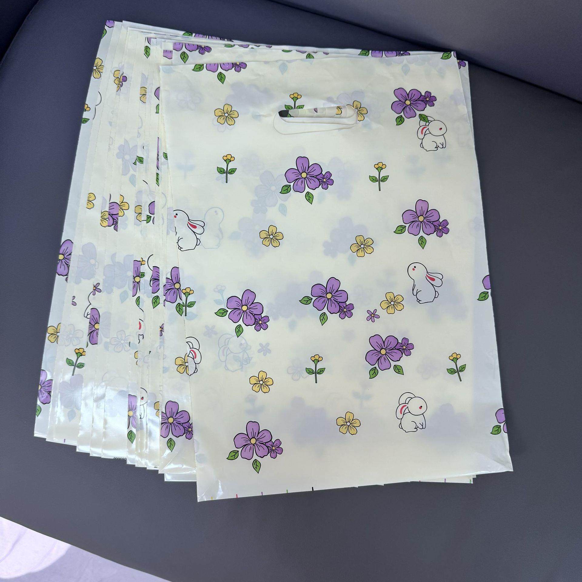 化妆礼品小饰品发夹塑料手提袋子服装店用包装卡通可爱四指扣手袋