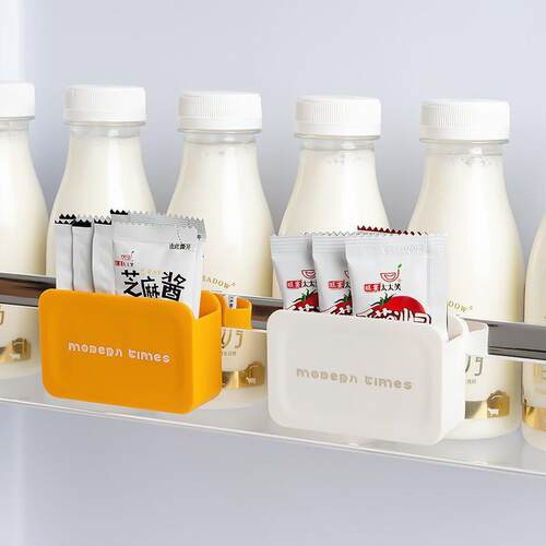 Wall-mounted storage box for the refrigerator side door, use