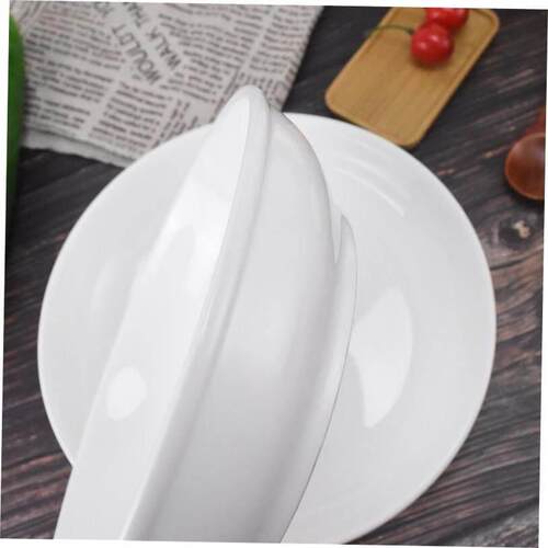 Plain white ceramic salad bowl deep soup plate chopped peppe