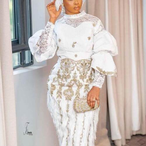 Embroidered long sleeved top, two women's tassel long