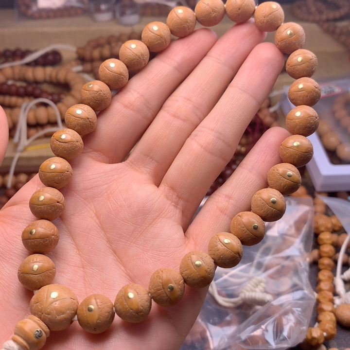 正圆大眼睛黄皮镶嵌铜钉12mm手持27颗尼泊尔小凤眼念珠