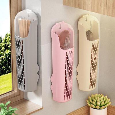 Wall-mounted plastic chopstick holder with a lid, used as a