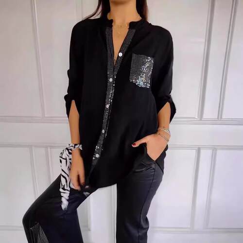 A women's black stylish sequin decorated long sleeved shirt