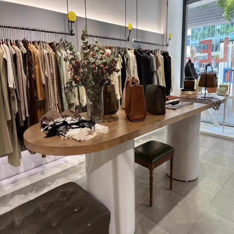 椭圆服装展示架服装店展示桌实木中岛台展示台落地长方形半圆桌子图片