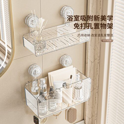 A suction cup-mounted, hole-free bathroom shelf made of tran