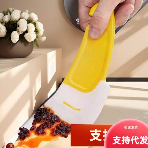 Yellow silicone spatula, kitchen stove flat-bottomed pan and