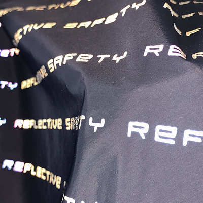 厂家直供七彩反光布料印花面料发光布炫彩幻彩夜光字母面料反光布