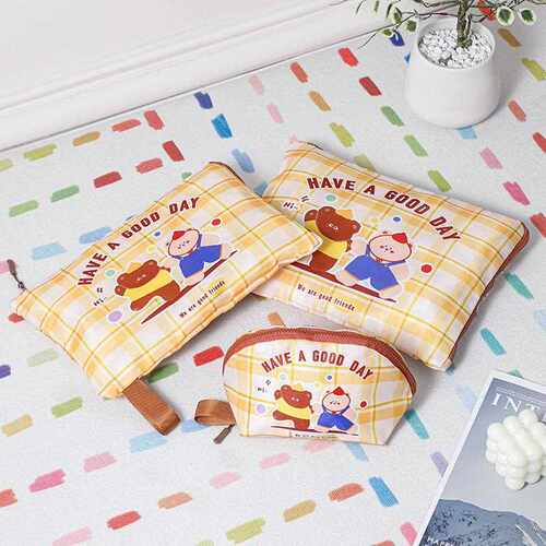 A set of three travel packing organizers with cute cartoon s