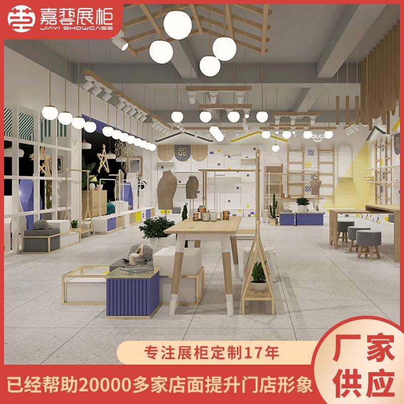 可爱童装店原木服装展示台童装店商场装修效果SI设计靠墙展柜