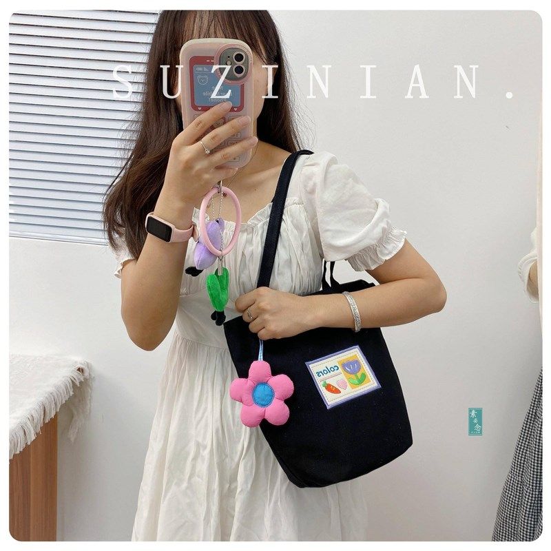 小众设计感简约可爱手提帆布包女水桶包文艺通勤上班族单肩帆布袋