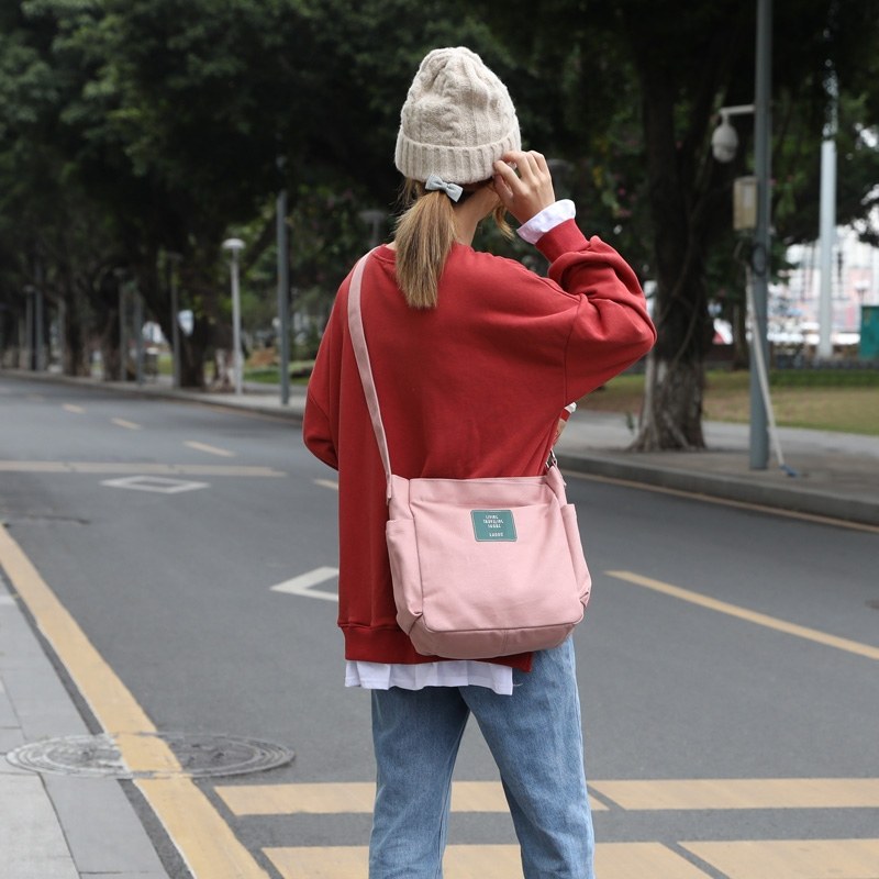 斜挎帆布包女日系文艺简约单肩包新款休闲女士通勤包包手提购物袋