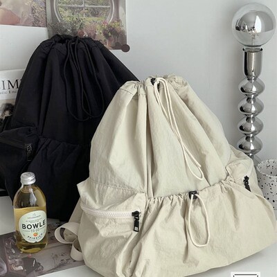 新款小众韩版抽绳束口轻便双肩揹包日常百搭简约通勤休闲学生书包