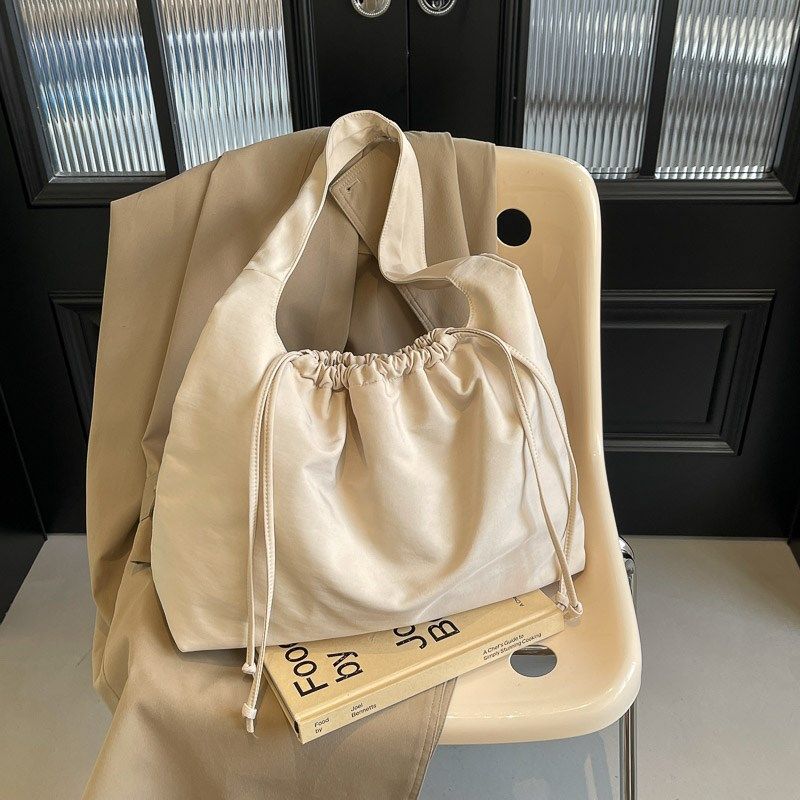 韩版休闲帆布包包女2024新款大容量单肩斜挎包上课抽绳通勤布大包,箱包皮具/热销女包/男包,托特包,淘宝优惠券,粉丝福利购,淘宝优惠卷