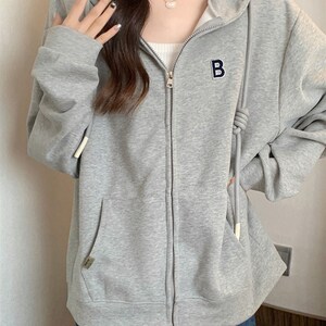 现货猫人连帽卫衣女春秋新款韩系慵D懒风字母拉链抽绳宽松秋装开