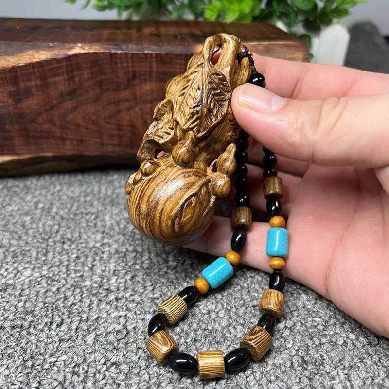 印尼沉香木手工木雕手捻小葫芦手把件木质文玩工艺品摆饰小挂件