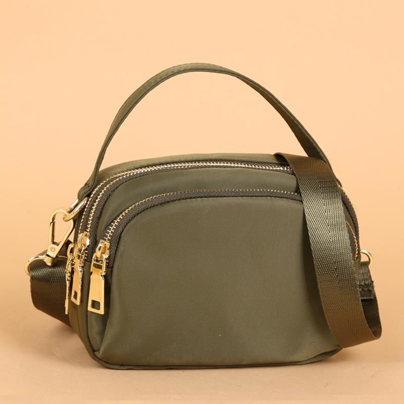 女2024新款轻斜挎包女帆布简约迷你手提中年妈妈小包女牛津布女包