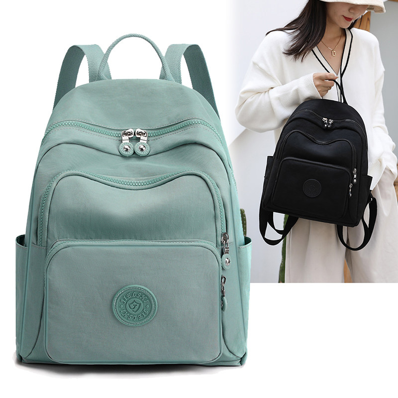 牛津布双肩包2023新款女轻便旅游多隔层大容量女揹包简约帆布书包