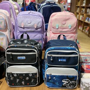 博酷双肩包学生1-3年级大容量轻便减负护脊新华书店文具柜同款