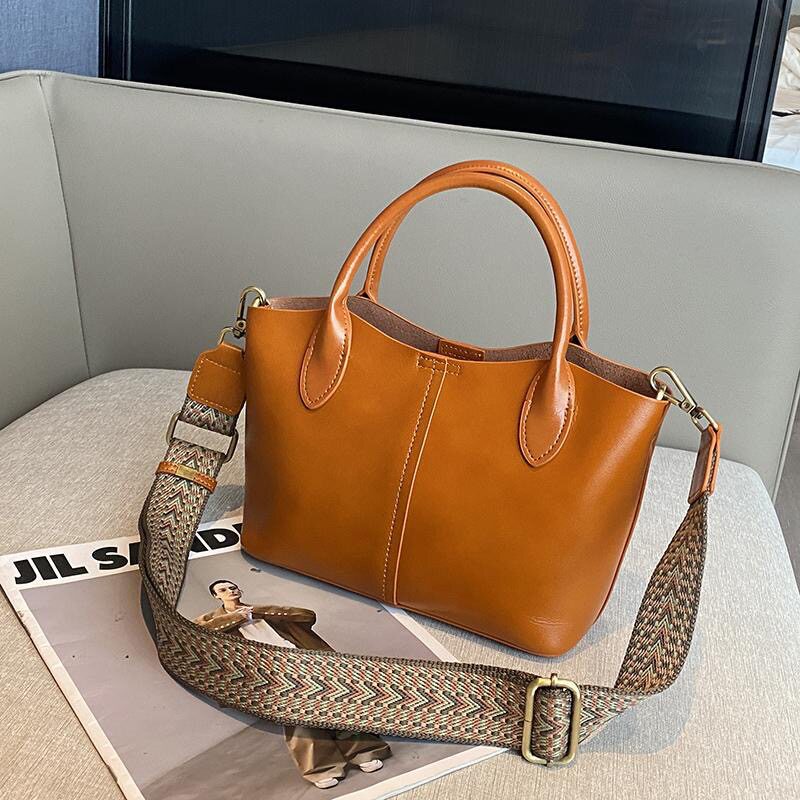 纯牛皮斜挎手提包女百搭2026春夏新款真皮大容量多隔层单肩托特包