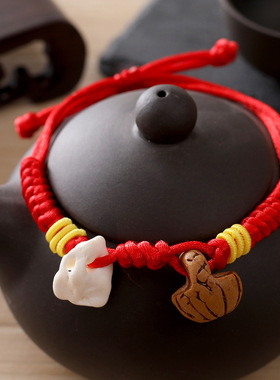 新款编织手链桃核猪惊骨宝宝手绳