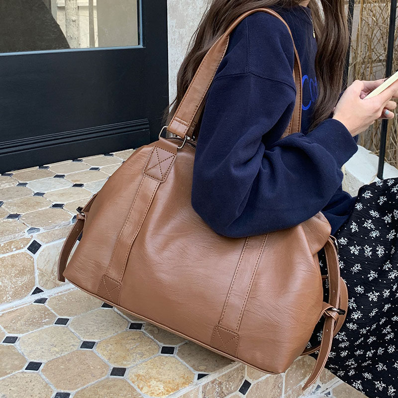 潮酷手提旅行包包女士2026新款韩版休闲托特包大容量斜挎包行李包