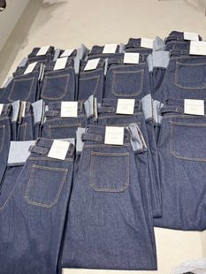 韩国东大门代购MELTED-P 2026春女装新款系扣口袋直筒休闲牛仔裤