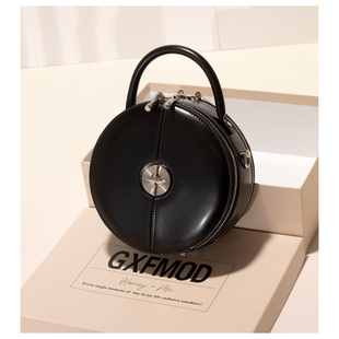 GXFMOD小众设计时尚真皮手提小圆包2026春爆款简约通勤斜挎小包