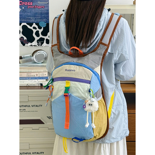 多巴胺撞色小众运动轻便书包学生防水双肩包户外徒步登山旅行背包