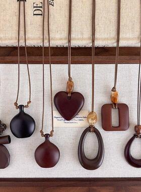 新中式复古长款不规则镂空木质吊坠项链时尚小众设计高级感毛衣链