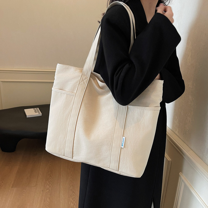 新款简约轻便大容量通勤托特包学生手提书包女式休闲百搭单肩大包,箱包皮具/热销女包/男包,托特包,淘宝优惠券,粉丝福利购,淘宝优惠卷