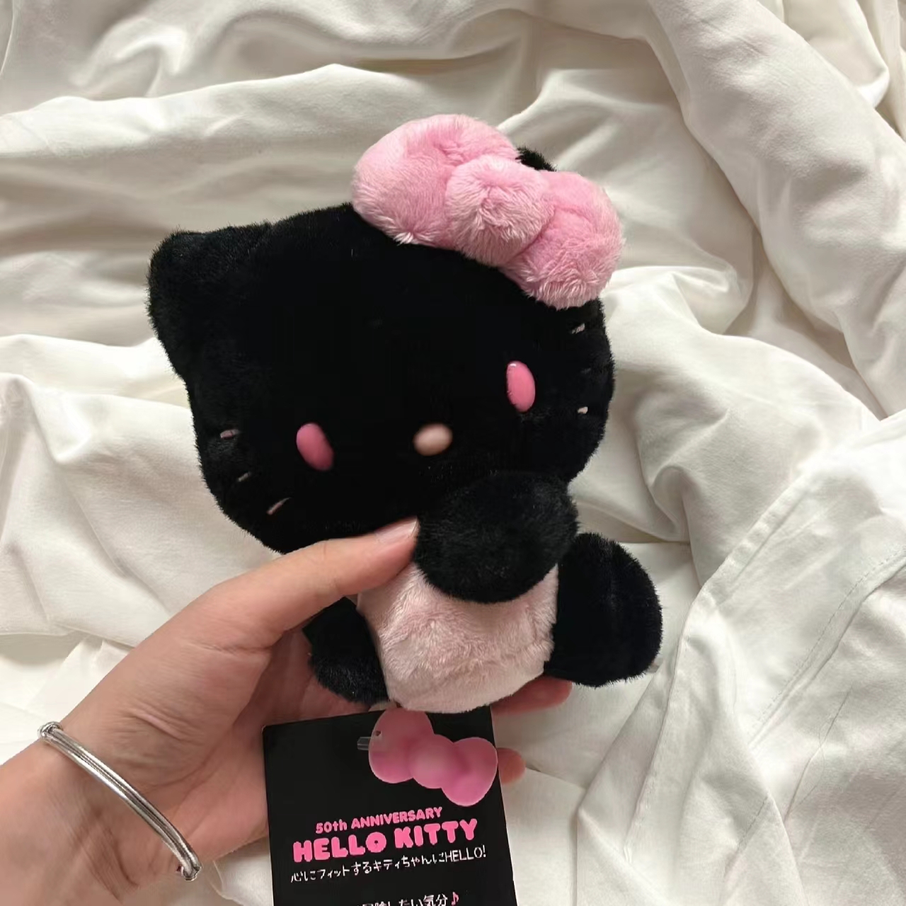 粉色背心kitty包包挂件书