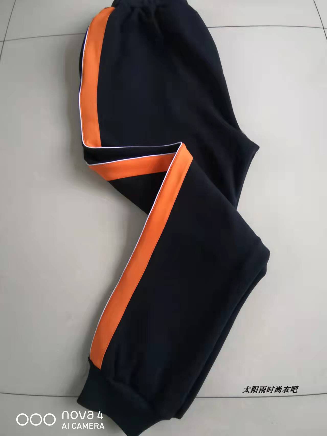 THE NEW SPRING AND AUTUMN SCHOOL UNIFORM PANTS ARE WIDE ORANGE AND THIN WHITE A CUFF OF JUNIOR HIGH SCHOOL AND PRIMARY SCHOOL BOYS AND WOMENS SWEATPANTS