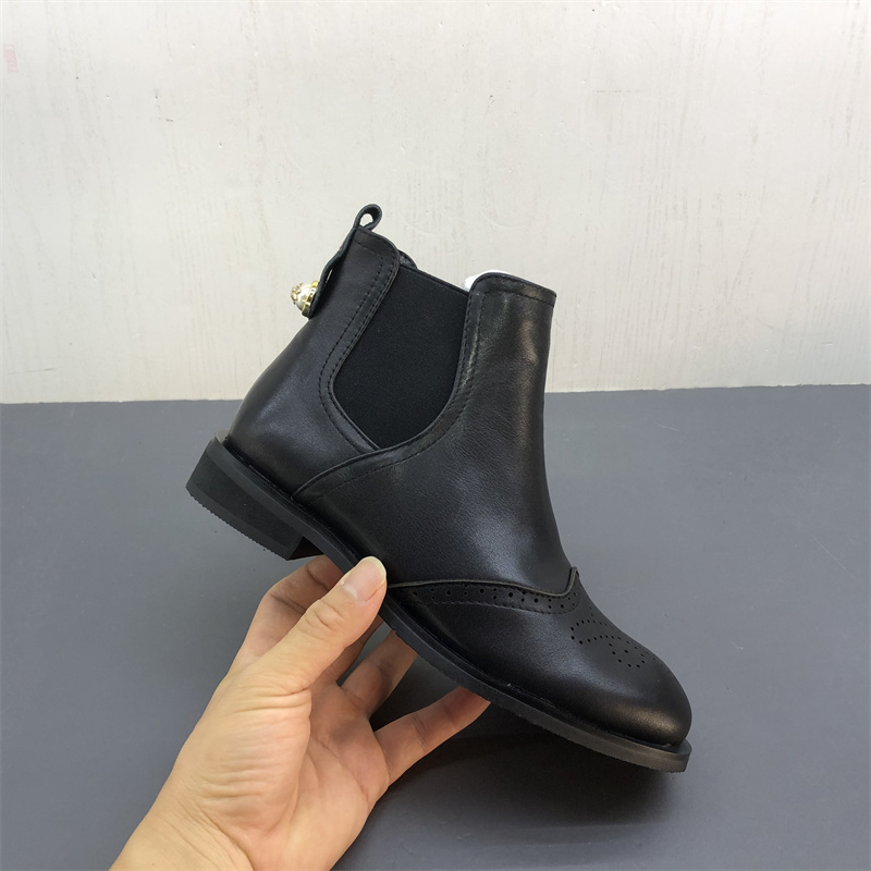 工厂断码真皮女鞋秋冬季新款布洛克圆头套筒粗跟保暖牛皮女短靴