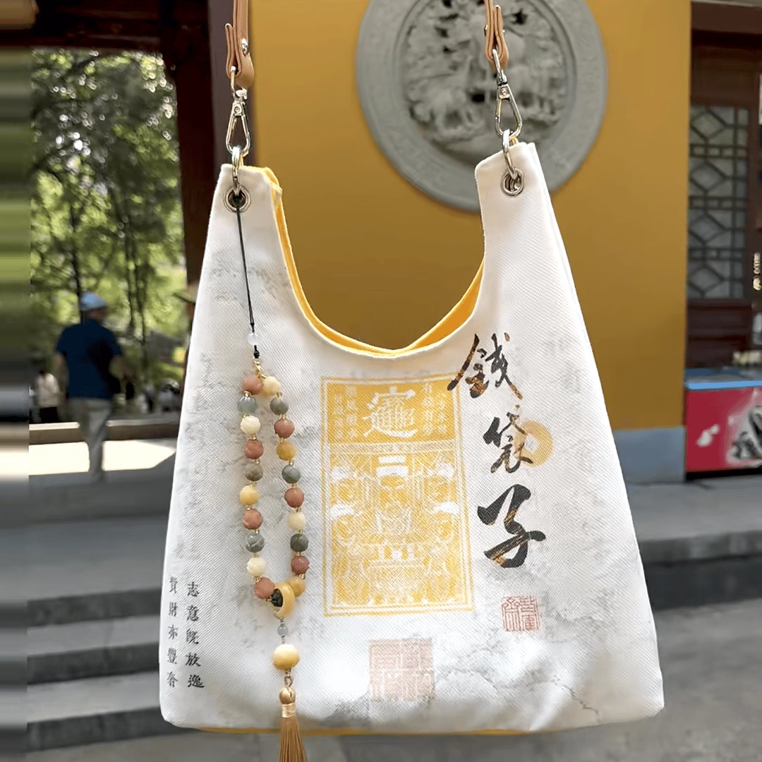杭州官方新款钱袋子帆布包招财女生斜挎手提包包收纳袋单肩背包