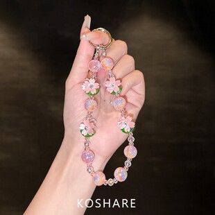 cxk桃花爆闪斜挎手机链条轻奢高级感水晶挂链时尚防摔手拎挂饰女