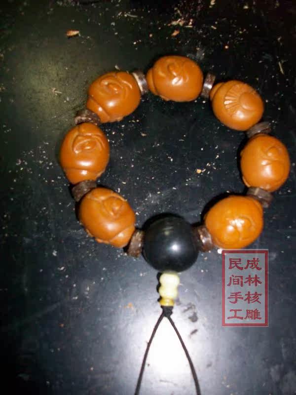 橄榄核雕招财弥勒  配牦牛角佛头