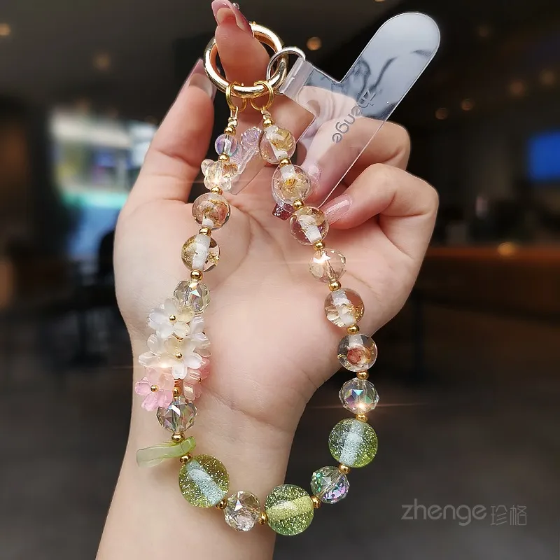 精致小众设计手机链挂绳轻奢高级感樱花挂饰水晶串珠手链金箔圆珠