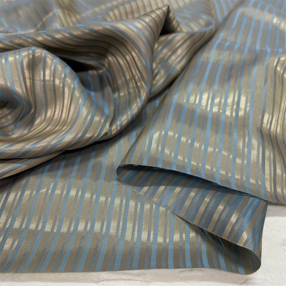 高端蓝咖竖条纹斜纹提花铜氨丝半棉防静电大衣西装内衬面料