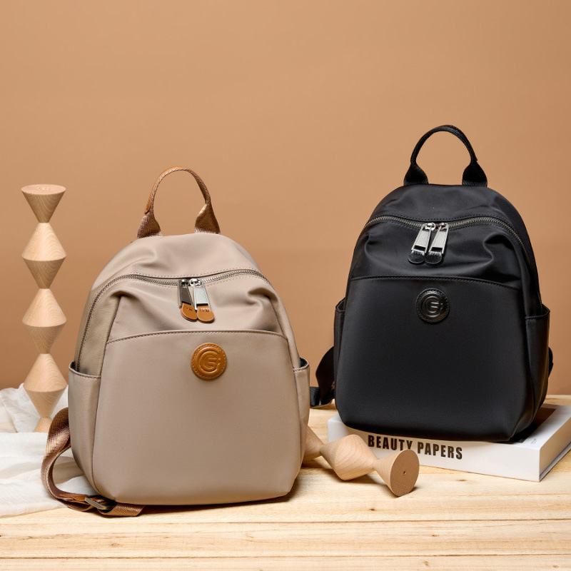 牛津布配牛皮多隔层收纳双肩包通勤大容量防溅水百搭轻便女士包包