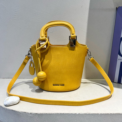 黄色水桶包时尚手提单肩斜挎包