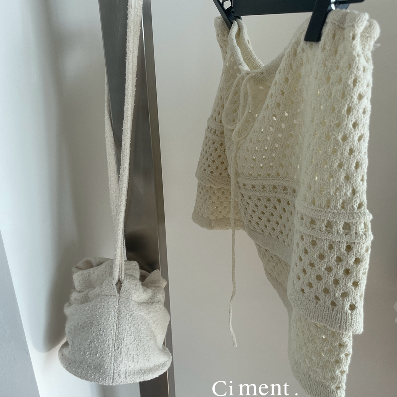 ciment 百搭温柔米白色针织镂空叠穿屁帘半身裙