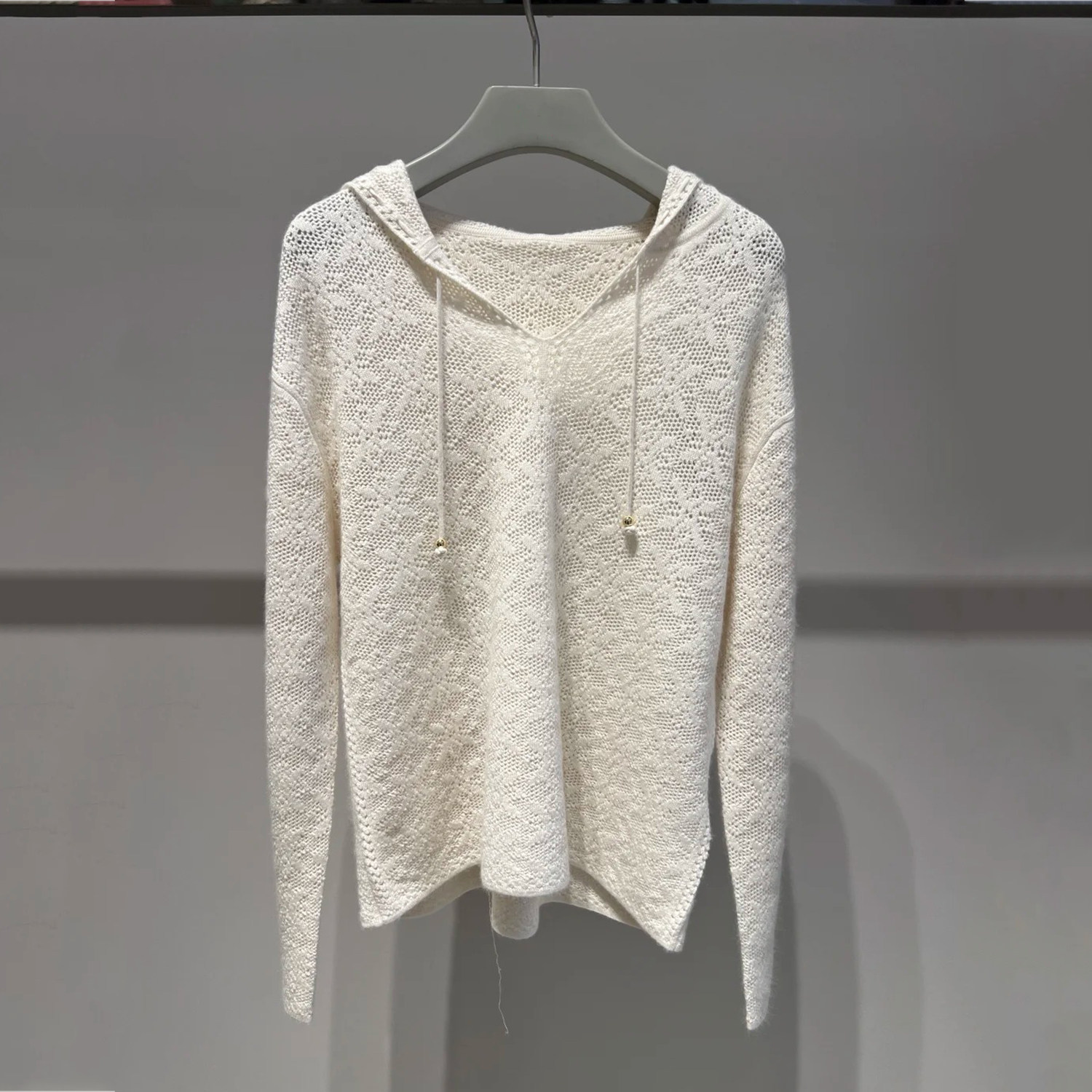 深圳南油高端女装2026春季新款休闲慵懒风连帽抽绳宽松毛针织衫女