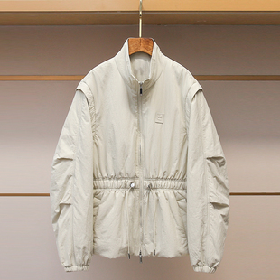 深圳南油高端女装2025冬新款简约风米白色棉服女抽绳收腰立领外套