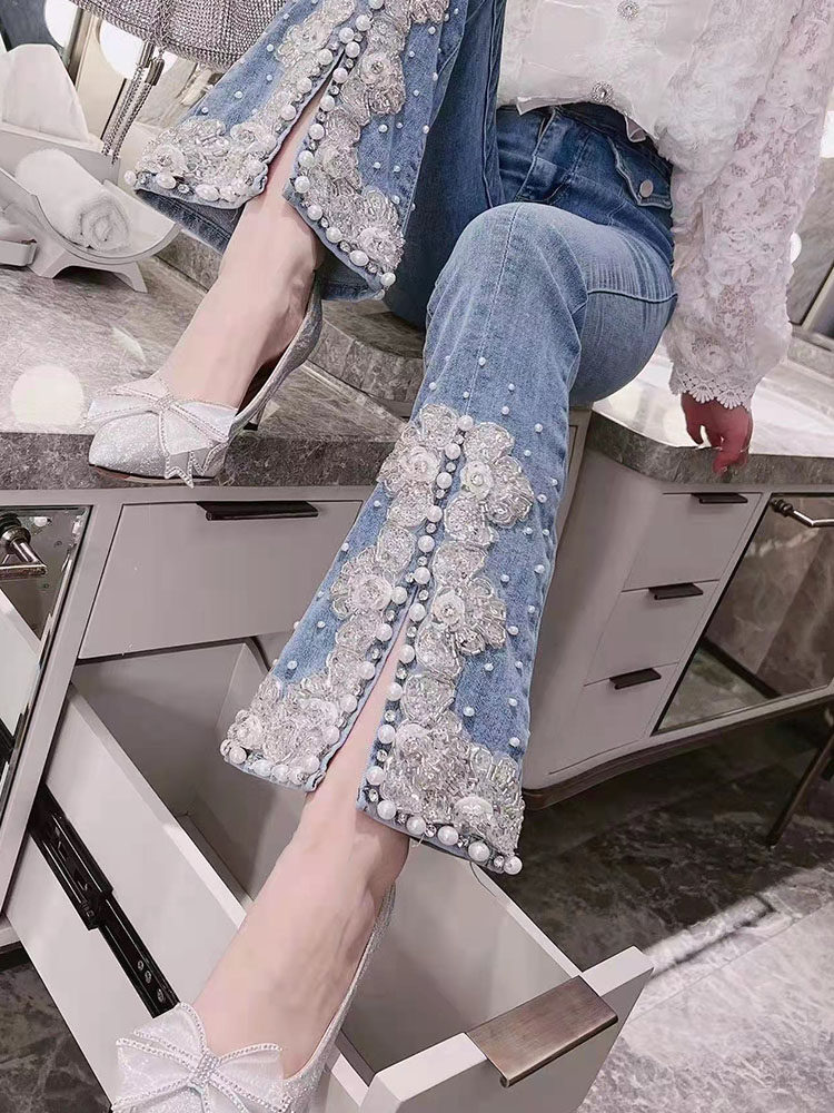 重工钉珠下摆开叉牛仔裤女