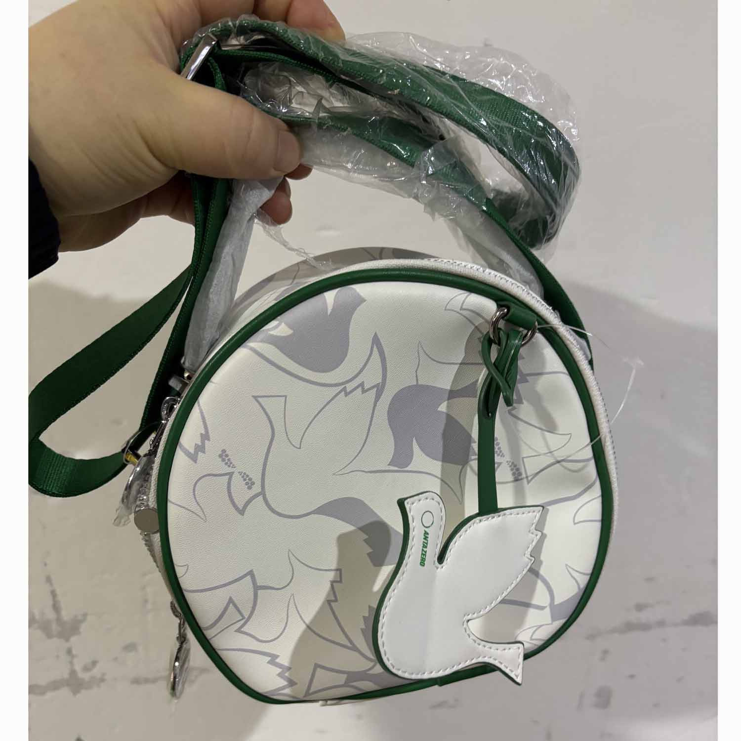 安踏正品四季休闲单肩斜跨小圆包女士皮面拉琏小跨包192438121G