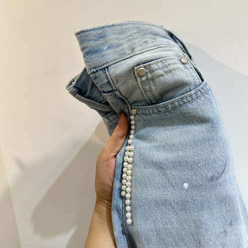 设计感水洗泼墨擦色钉珠弯刀牛仔裤女秋冬26新款复古休闲蓝色长裤