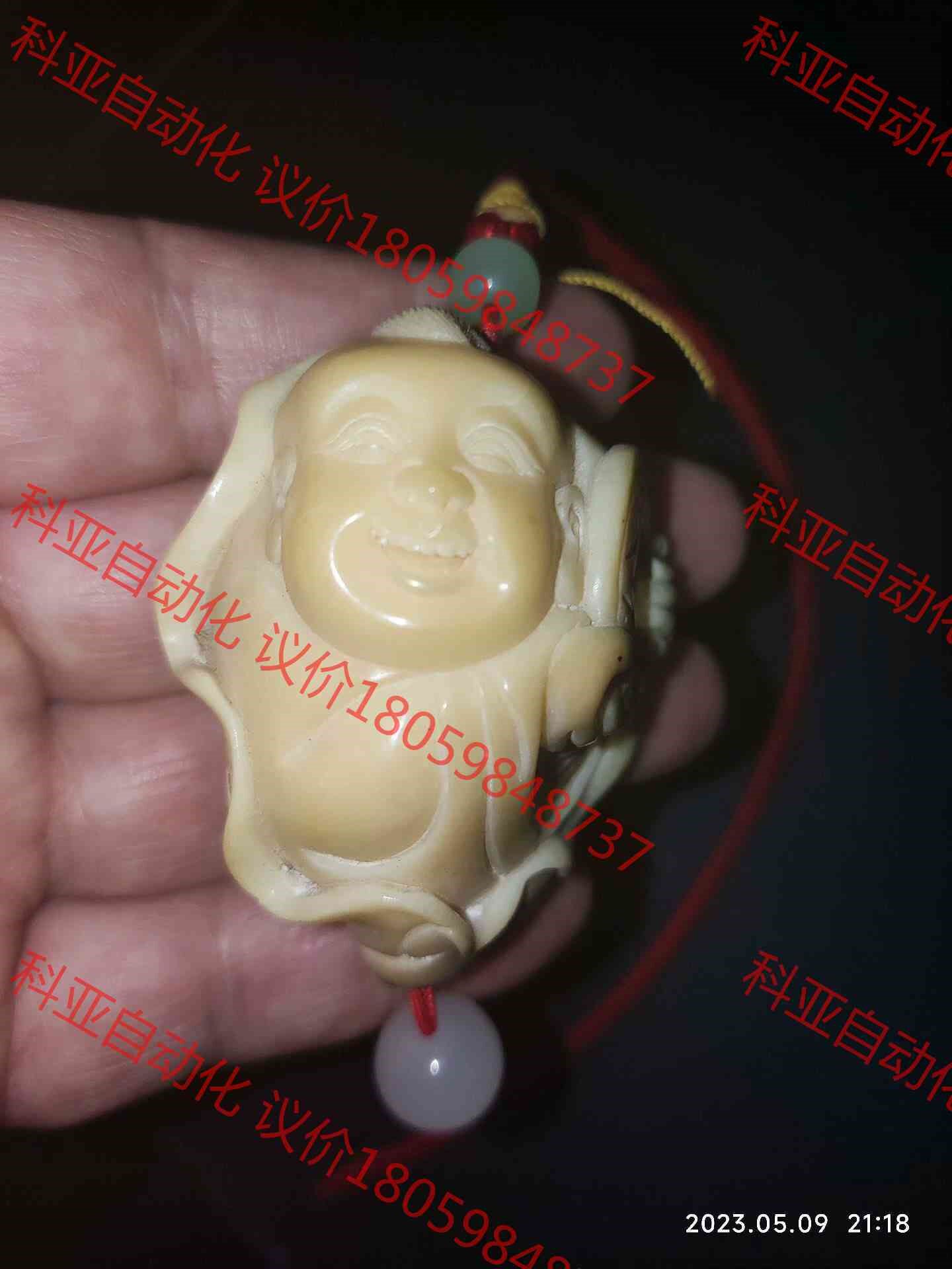 十五年前托人从潘家园带的，象芽果雕刻“求财童子”，目前表面有