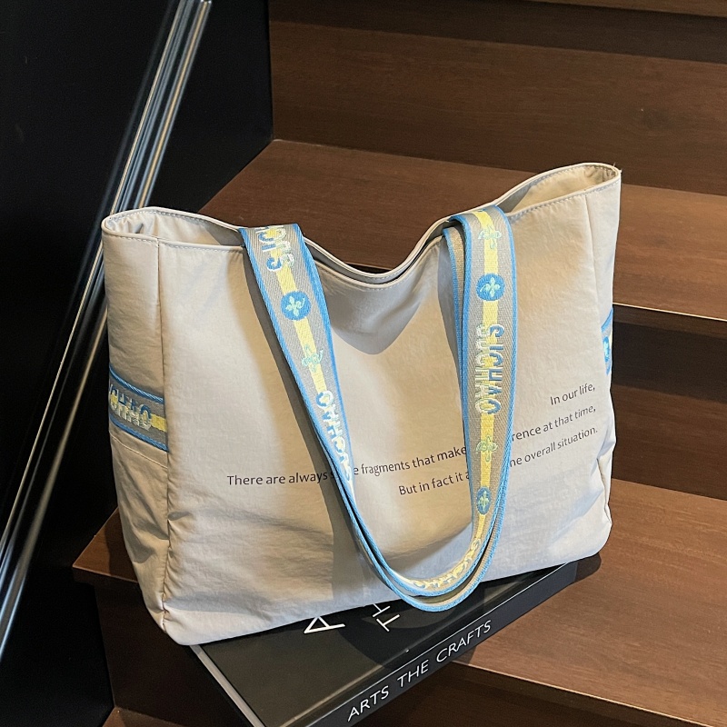 大容量尼龙布包包女2025新款外出旅行手提袋松弛感通勤单肩托特包