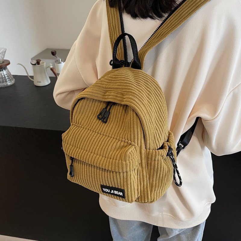 冬季条绒双肩包女2025新款百搭斜挎胸包学生书包迷你小型旅行背包