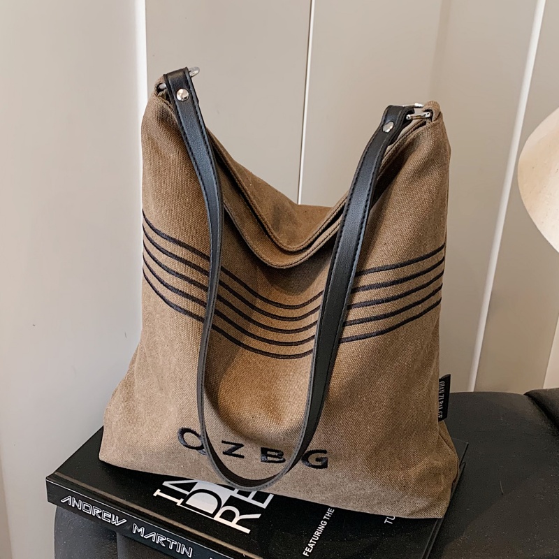 质感复古帆布包大容量通勤水桶包